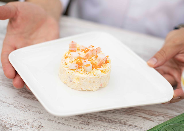 Russian salad with crab sticks and prawns